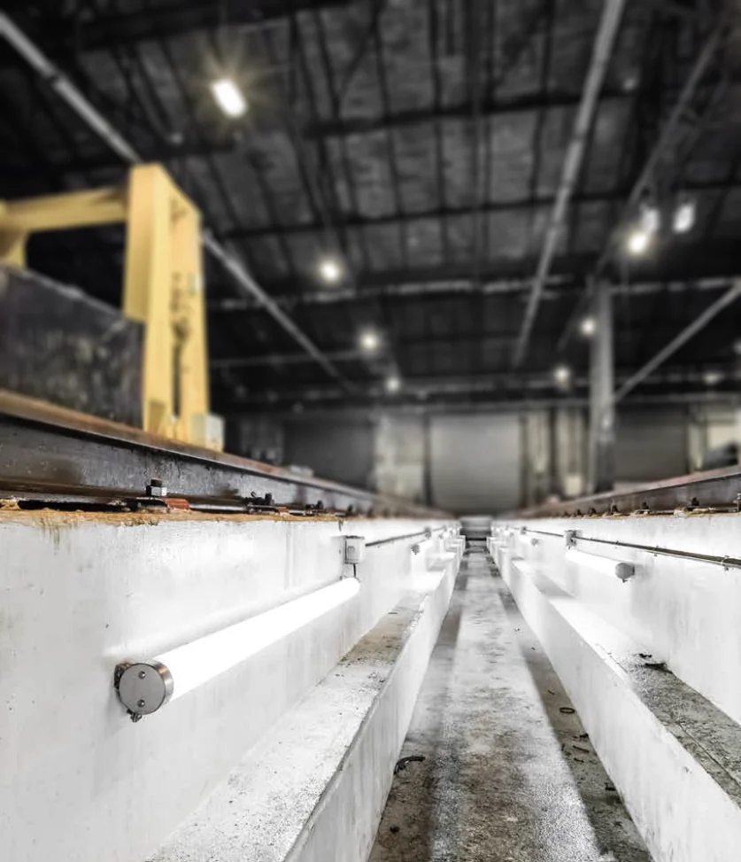 FILA luminaires along the steps of an industrial space