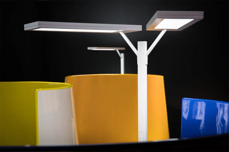 Radian freestanding luminaires above colourful workstations